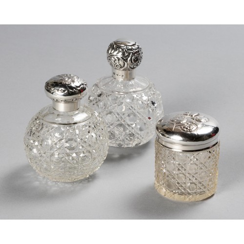 237 - TWO SILVER-MOUNTED AND GLASS SCENT BOTTLES AND ONE SILVER-MOUNTED AND GLASS DRESSING TABLE JAR, BIRM... 