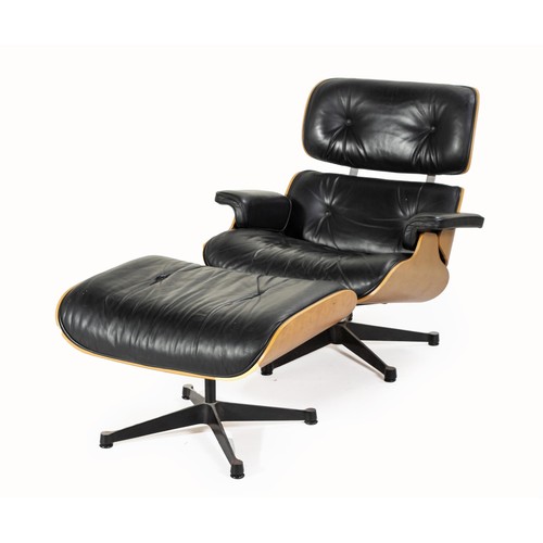 A LOUNGE CHAIR AND OTTOMAN, DESIGNED IN 1956 BY CHARLES AND RAY EAMES, MANUFACTURED BY VITRA