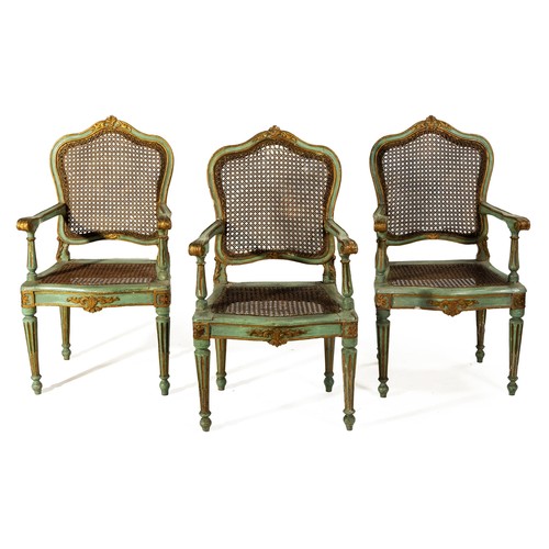 634 - THREE FRENCH PAINTED AND GILDED OPEN ARMCHAIRS, EARLY 19TH CENTURY