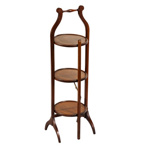 617 - A MAHOGANY FOLDING THREE-TIER CAKE STAND