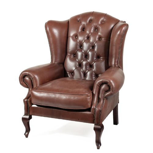 A LEATHER WINGBACK ARMCHAIR