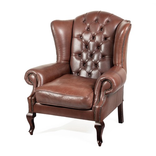 612 - A LEATHER WINGBACK ARMCHAIR