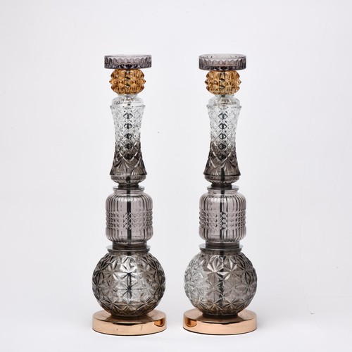 556 - A PAIR OF GLASS CANDLESTICKS