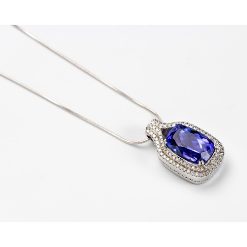 113 - A TANZANITE AND DIAMOND PENDANT