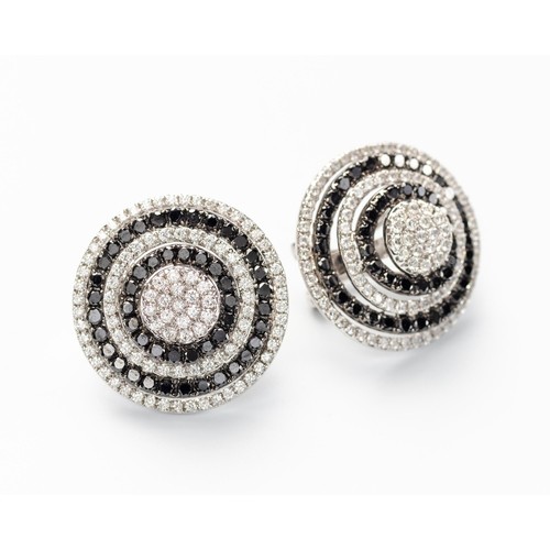 70 - A PAIR OF BLACK AND WHITE DIAMOND EARRINGS