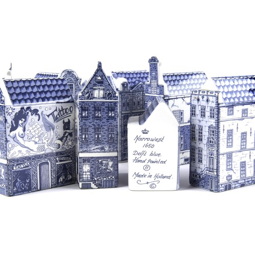 905 - A COLLECTION OF NINE DUTCH DELFT BLUE AND WHITE MINIATURE CANAL HOUSES