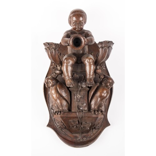 633 - A LARGE CONTINETNAL CARVED WOODEN FIGURAL WALL PLAQUE OF A BOY WITH TWO OWLS