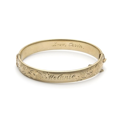 1468 - A 9CT GOLD PLATED METAL CORE BANGLE, LONDON, 20TH CENTURY