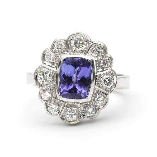 1443 - A DIAMOND AND TANZANITE DRESS RING