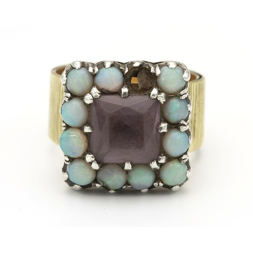 1452 - AN OPAL AND AMETHYST DRESS RING