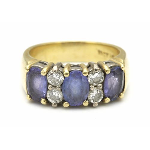 1442 - A TANZANITE AND DIAMOND RING