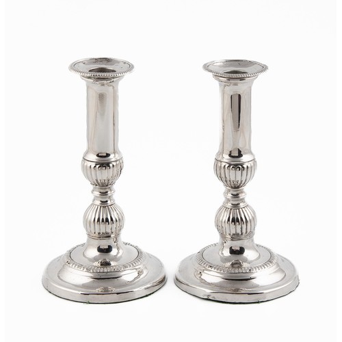 311 - A PAIR OF SILVER-PLATE CANDLESTICKS