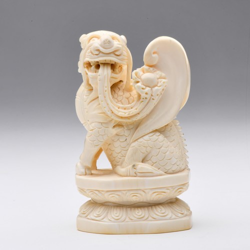 472 - A PAIR OF CHINESE MARINE TUSK CARVING'S OF A SEATED BIXI