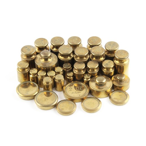 411 - A SET OF BRASS WEIGHTS