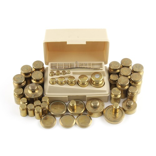 411 - A SET OF BRASS WEIGHTS