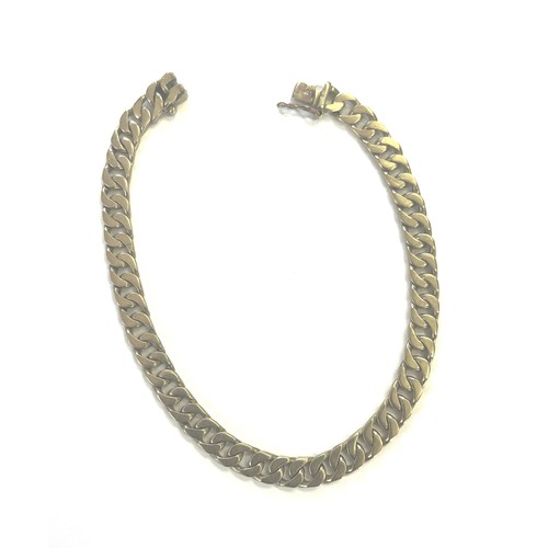 1381 - A GOLD CURB LINK BRACELET