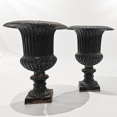 968 - A PAIR OF BLACK-PAINTED CAST-IRON GARDEN URNS