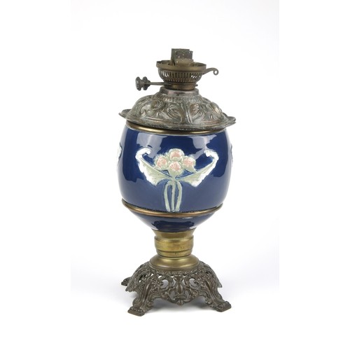 603 - A BRASS AND ENAMEL OIL LAMP