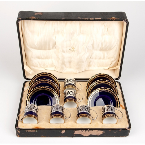 642 - AN AYNSLEY CASED DEMITASSE SET WITH SILVER HOLDERS, 1935