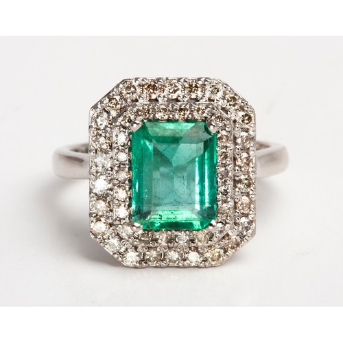 54 - AN EMERALD AND DIAMOND RING