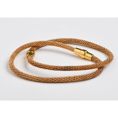 707 - A PAIR OF MATCHING YELLOW GOLD PLATED MAGNETIC BANGLES
