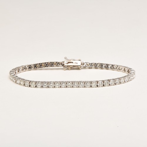 143 - A DIAMOND TENNIS BRACELET, 4.50 CARATS