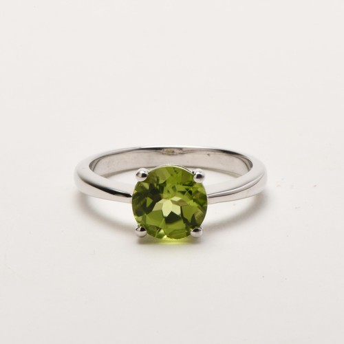 65 - A SOLITAIRE PERIDOT RING