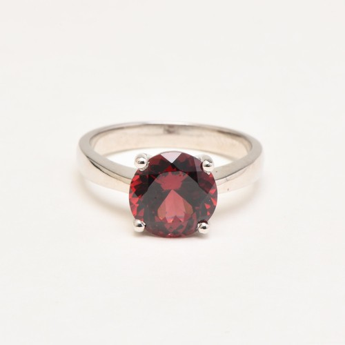 66 - A SOLITAIRE AMETHYST RING