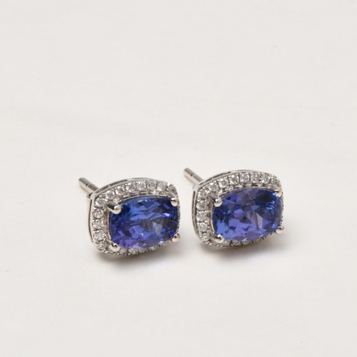 85 - A PAIR OF DIAMOND AND TANZANITE EARRINGS