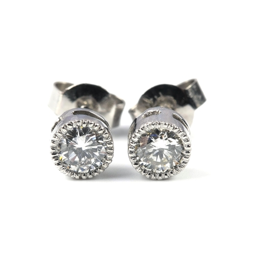 81 - A PAIR OF DIAMOND STUD EARRINGS, 0.56 CARATS