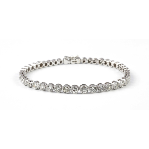 144 - A DIAMOND TENNIS BRACELET, 4.58 CARATS