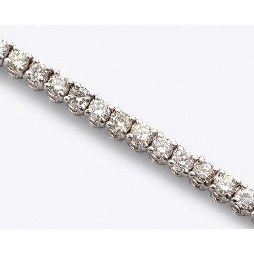 143 - A DIAMOND TENNIS BRACELET, 4.50 CARATS