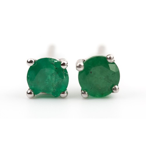 452 - A PAIR OF EMERALD STUDS, 0.25 CARATS