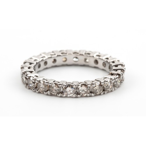 426 - A DIAMOND ETERNITY RING, 1.20 CARATS