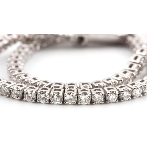 475 - A DIAMOND TENNIS BRACELET, 3.50 CARATS