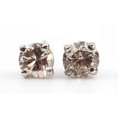 450 - A PAIR OF DIAMOND STUDS, 0.64 CARATS