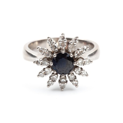 428 - A SAPPHIRE AND DIAMOND DRESS RING