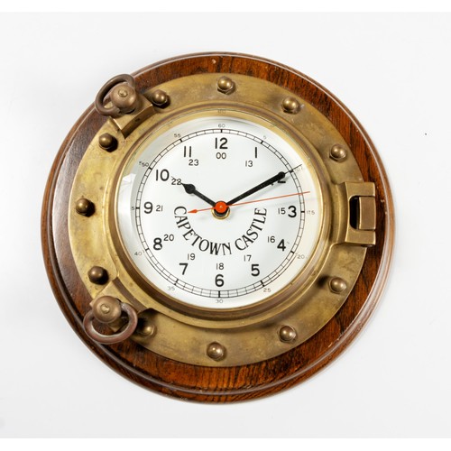 171 - A 'CAPE TOWN CASTLE' BRASS PORT HOLE STYLE QUARTZ CLOCK