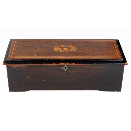 210 - A ROSEWOOD, EBONISED AND INLAID MUSICAL BOX