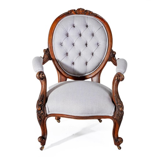 781 - A VICTORIAN WALNUT AND UPHOLSTERED ARMCHAIR