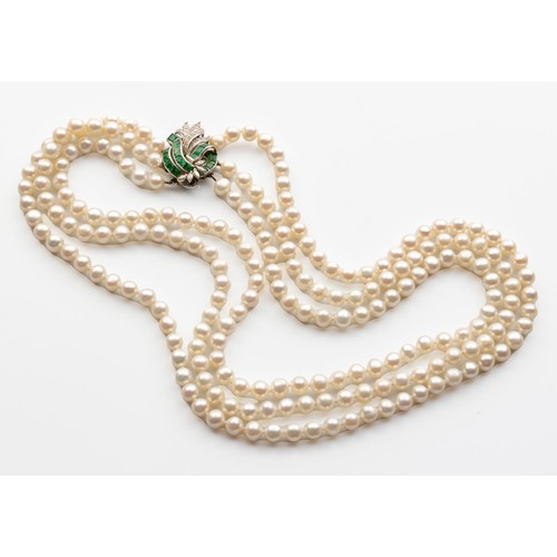 690 - A THREE-STRAND PEARL NECKLACE