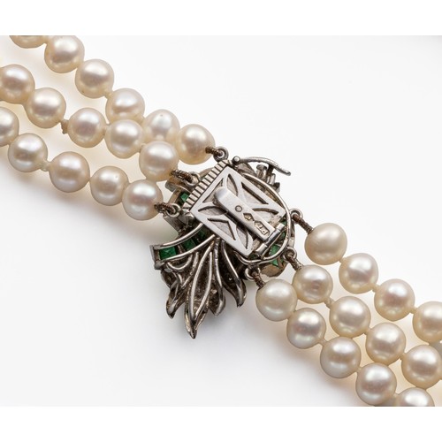 690 - A THREE-STRAND PEARL NECKLACE