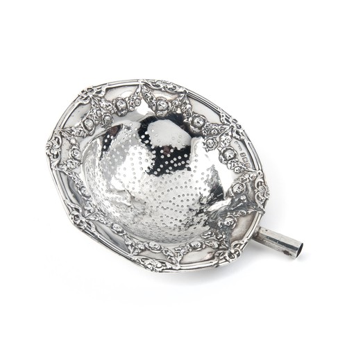 918 - A SILVER TEA STRAINER, MAKER AND DATE MARKS RUBBED