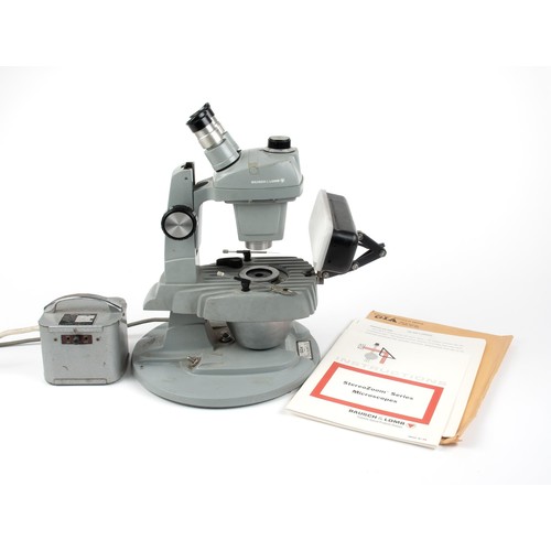 215 - A BAUSCH AND LOMB STEREOLITE MARK V GEMOLITE GIA MICROSCOPE AND TRANSFORMER, CIRCA 1960