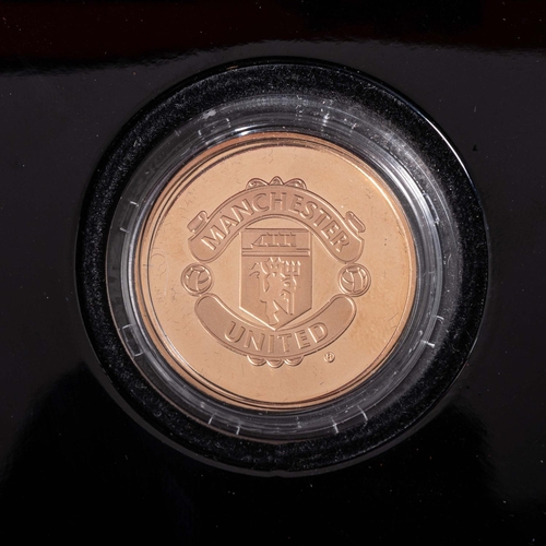 A MANCHESTER UNITED OLD TRAFFORD COIN