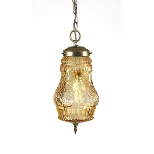 859 - AN AMBER GLASS BRASS MOUNTED LANTERN