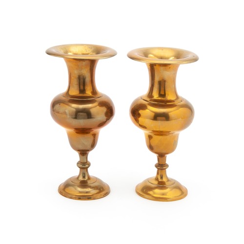 242 - A PAIR OF BALUSTER-SHAPED BRASS PEDESTAL URNS