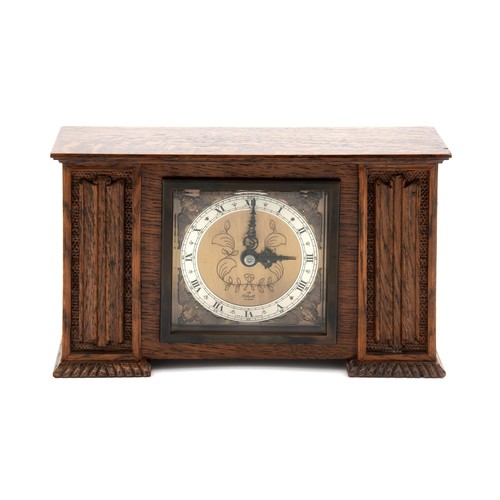 269 - A WOODEN MANTLE CLOCK