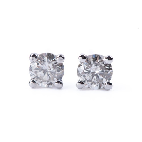 720 - A PAIR OF DIAMOND STUDS, 0,60 CARATS