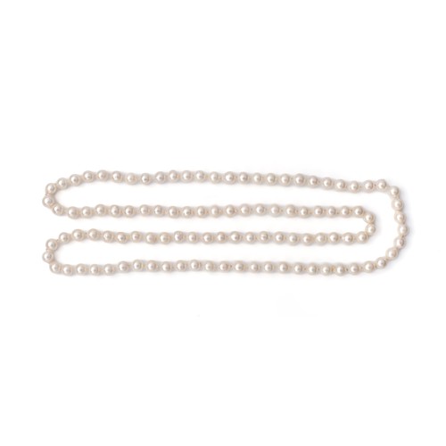 687 - A STRAND OF OPERA LENGTH PEARLS